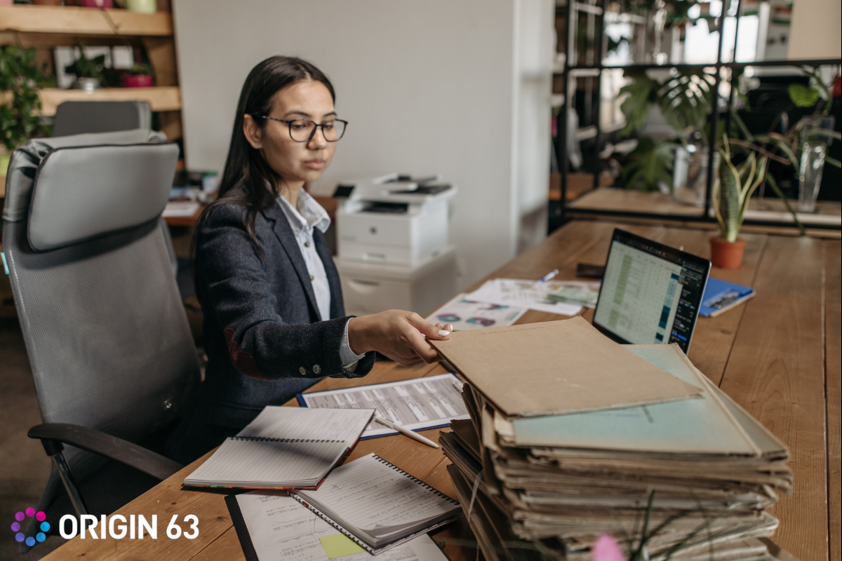 Woman in office wasting time on manual tasks
