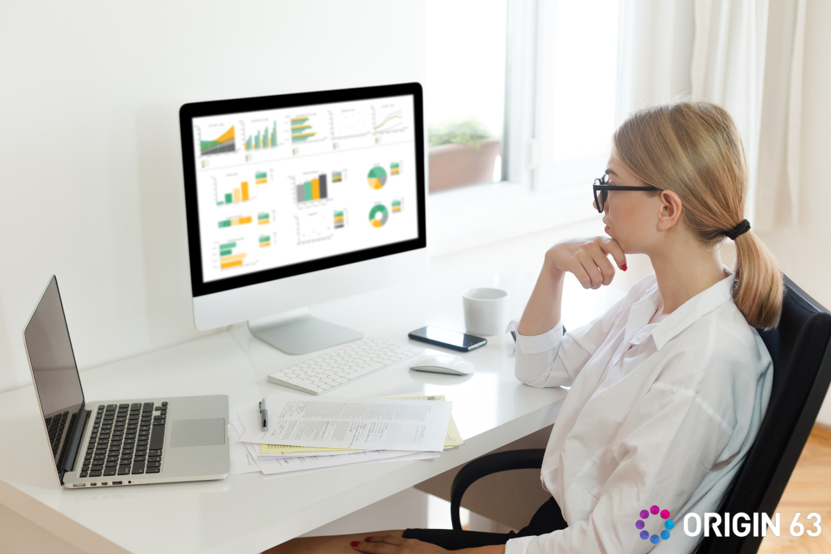 : Business leader looking at data, post-migration optimization