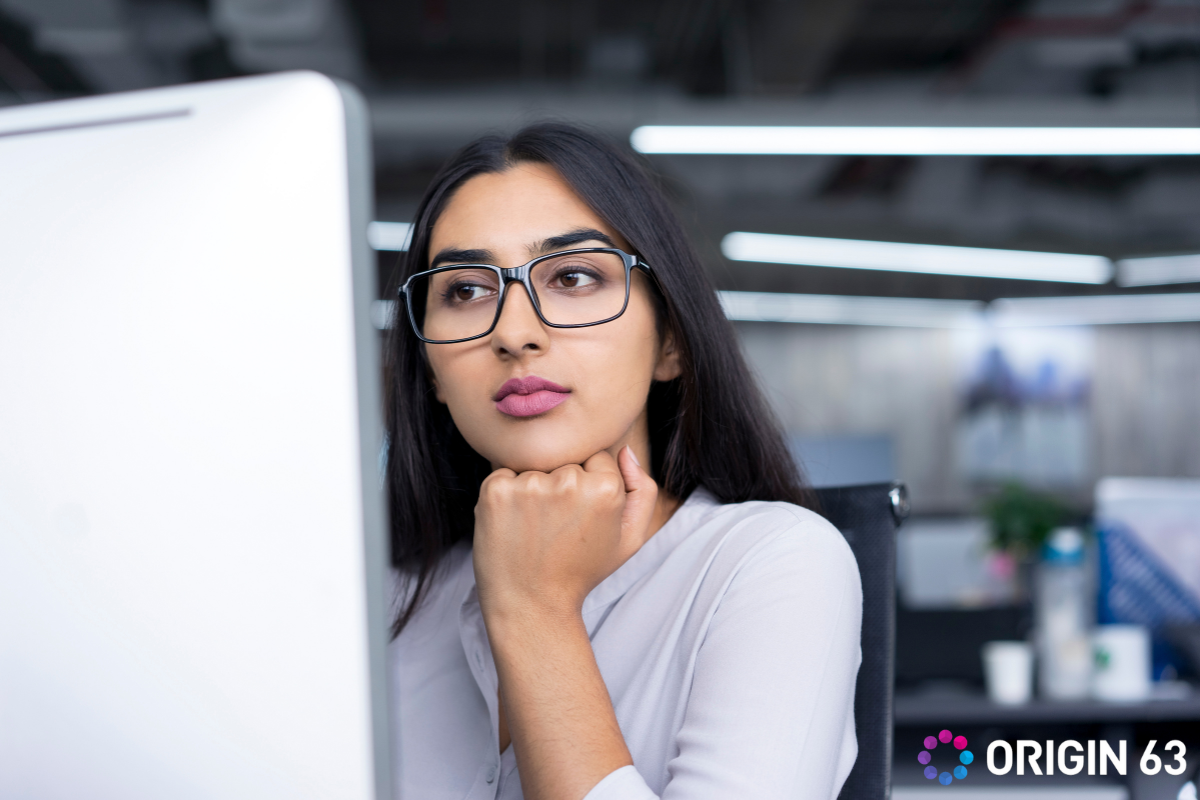 Business leader studying something on computer, why migrate from salesforce to HubSpot