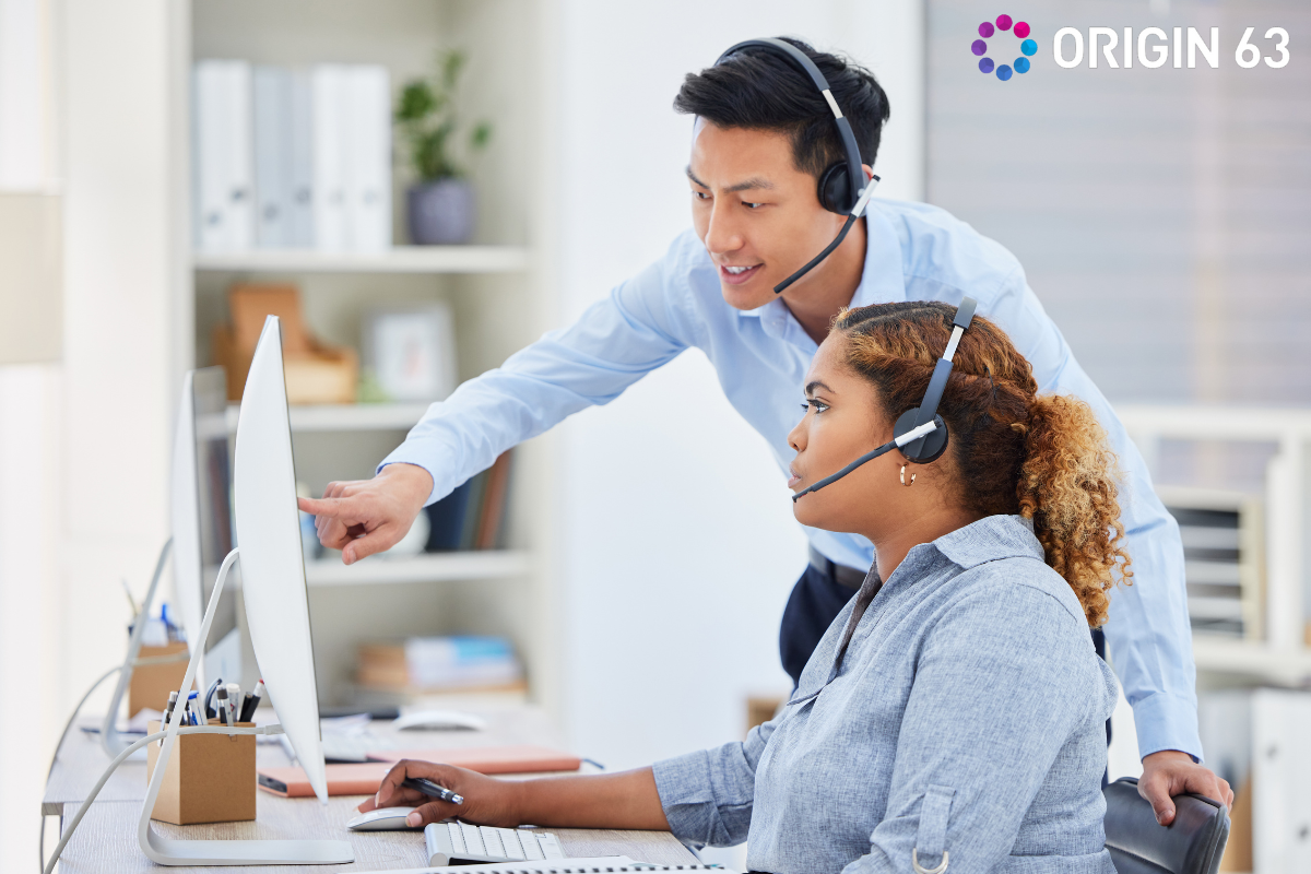 Customer service rep is trained by a senior