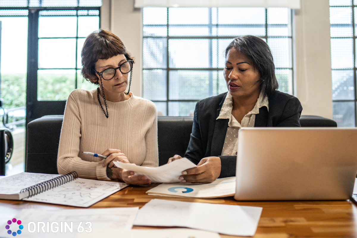 two-people-discussing-crm-options-hubspot-or-zoho