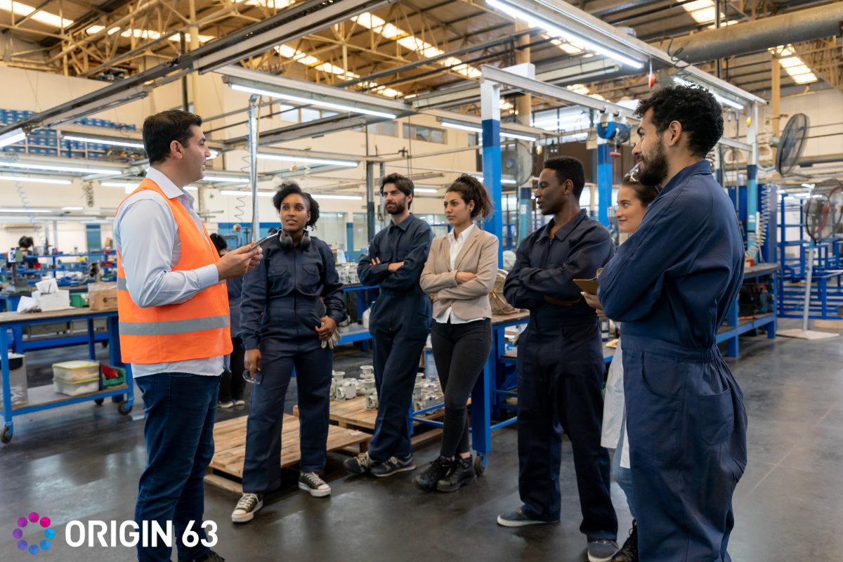a-team-of-manufacturing-workers-talking-with-their-manager